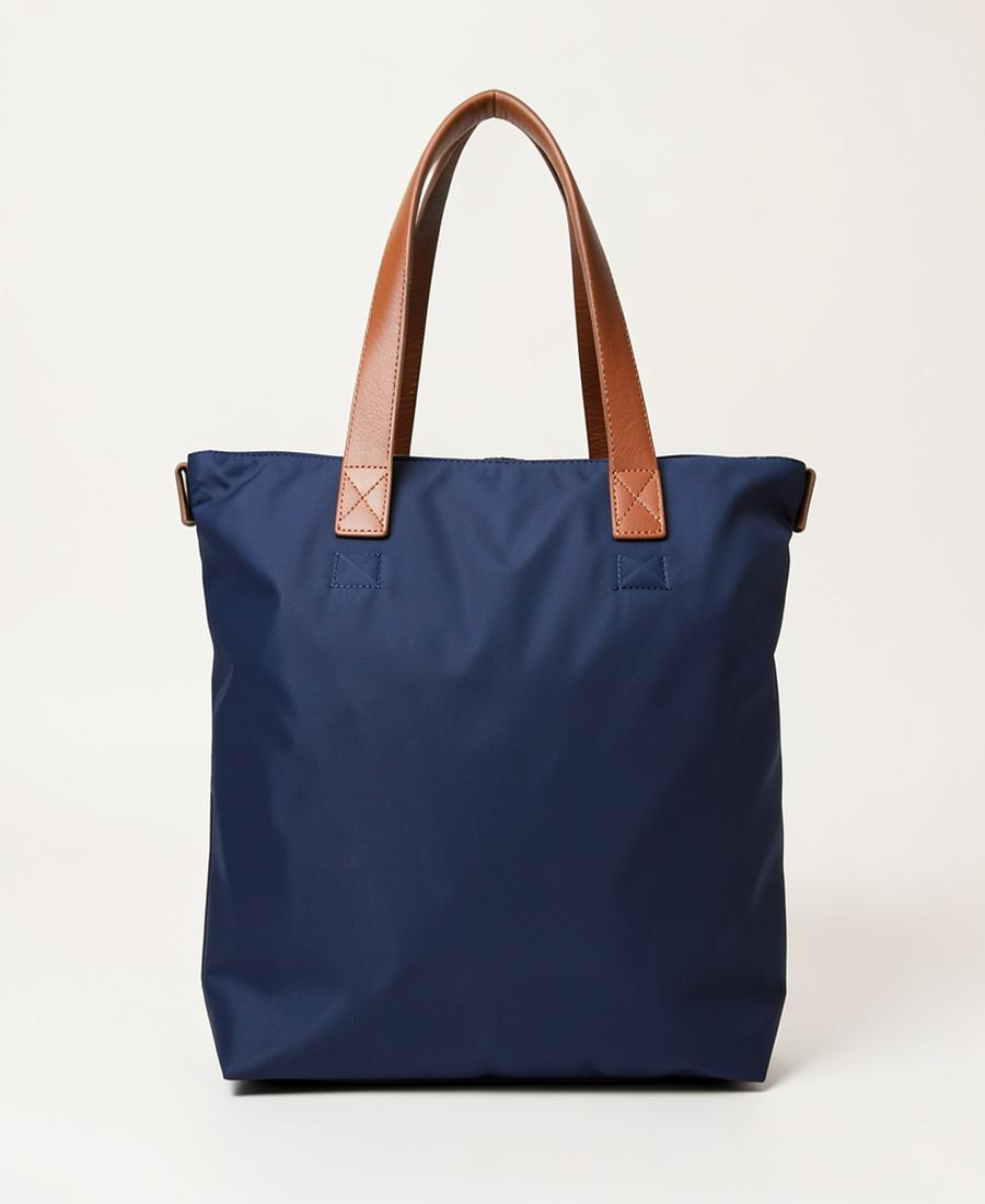 Navy nylon foldable tote with leather handles